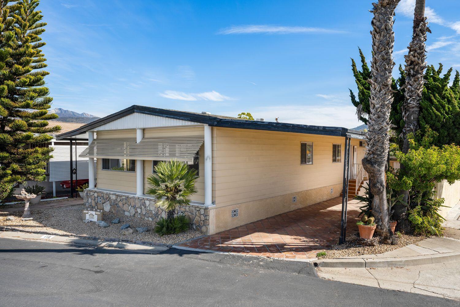 6180 Via Real, Unit 118 Carpinteria, CA 93013 - Photo 2 of 37 a front view of a house with a yard