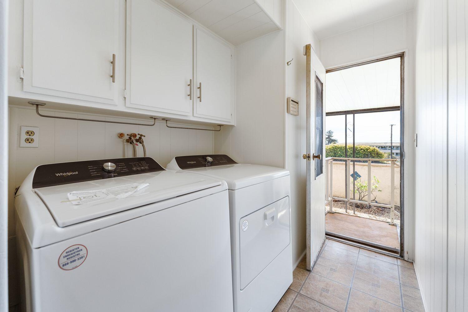 6180 Via Real, Unit 118 Carpinteria, CA 93013 - Photo 26 of 37 a view of washer and dryer with white cabinets