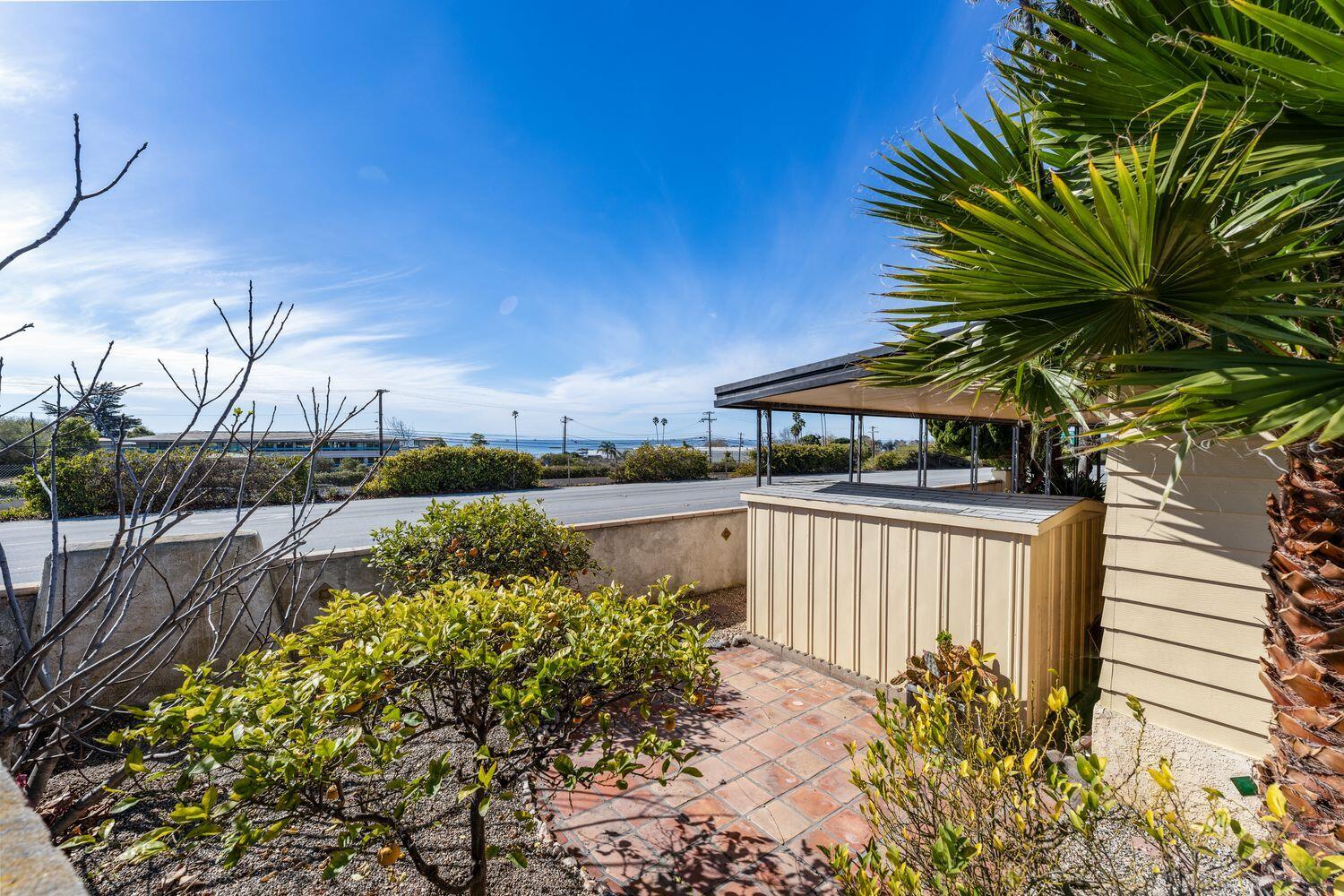 6180 Via Real, Unit 118 Carpinteria, CA 93013 - Photo 31 of 37 a view of a lake with a garden