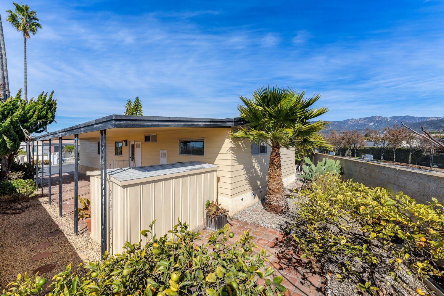6180 Via Real, Unit 118 Carpinteria, CA 93013 - Photo 32 of 37 a view of a house with a yard