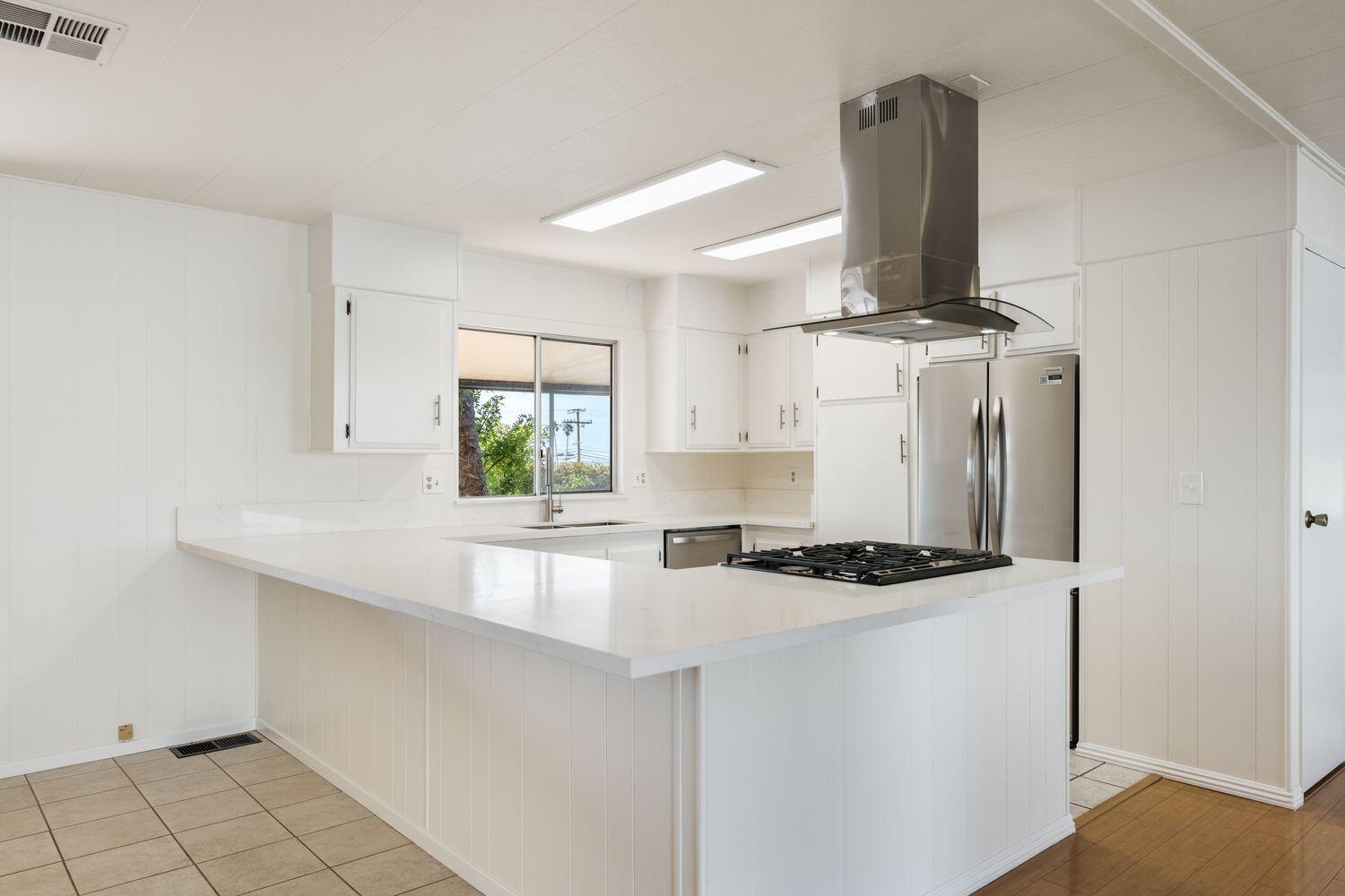 6180 Via Real, Unit 118 Carpinteria, CA 93013 - Photo 8 of 37 a kitchen with a sink cabinets and window