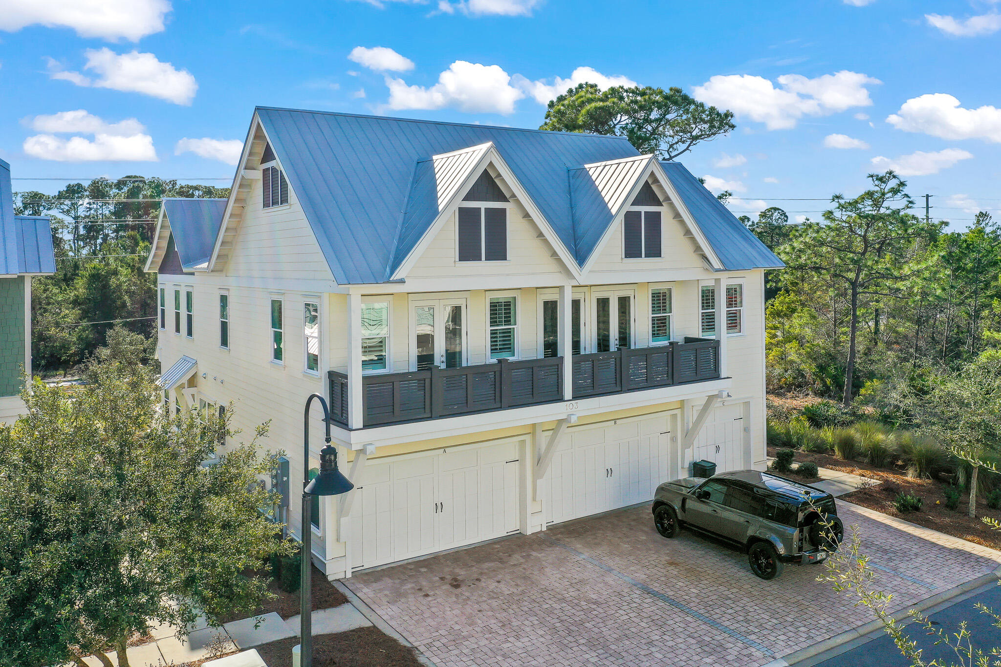 103 Milestone Dr Inlet Beach, Unit A Inlet Beach, FL 32461 - Photo 2 of 49 a front view of a house with balcony