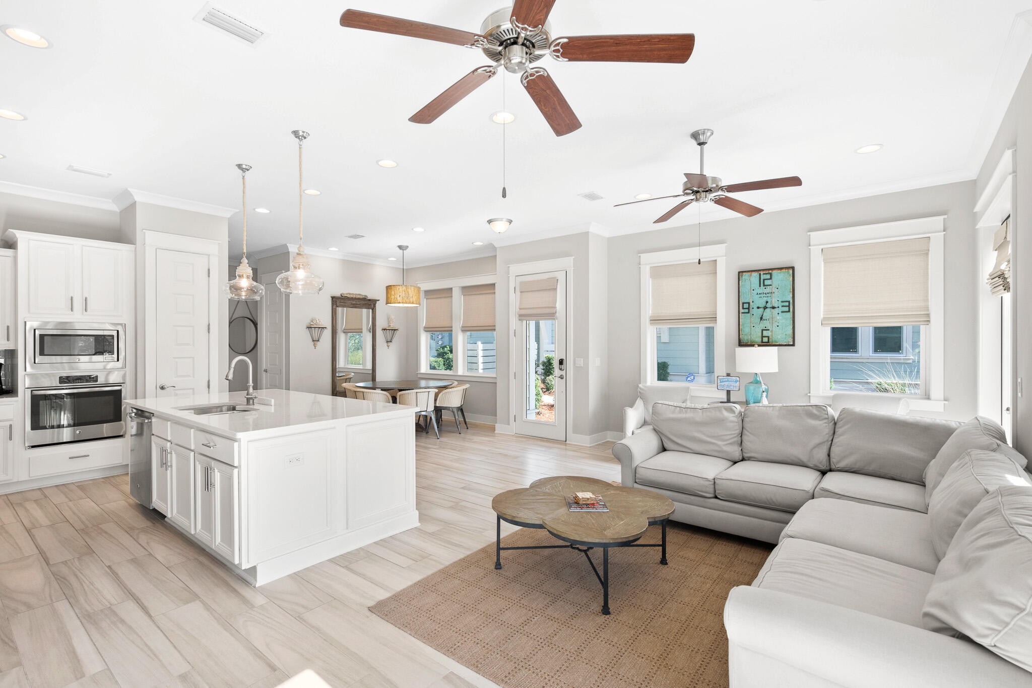 103 Milestone Dr Inlet Beach, Unit A Inlet Beach, FL 32461 - Photo 9 of 49 a living room with furniture and a chandelier