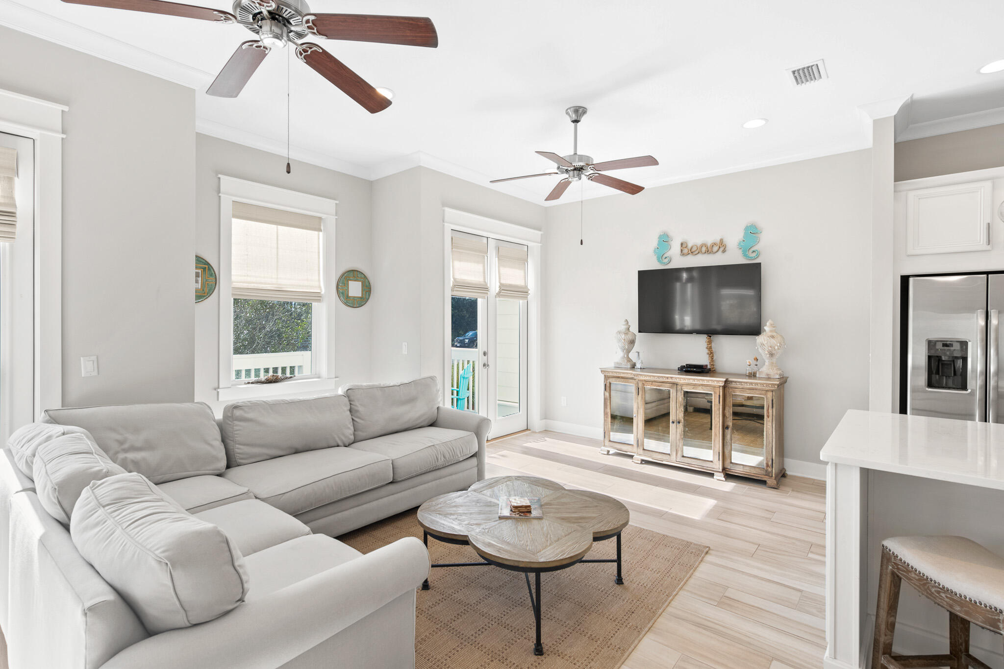 103 Milestone Dr Inlet Beach, Unit A Inlet Beach, FL 32461 - Photo 10 of 49 a living room with furniture a fireplace and a flat screen tv
