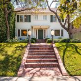 a front view of a house with swimming pool