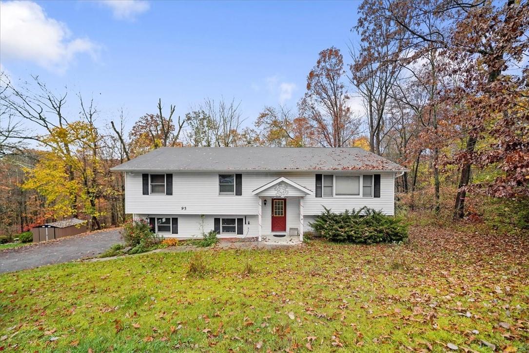 95 Alexander Road Monroe, NY 10950 - Photo 1 of 1 a view of a house with a large tree and a yard in front of it