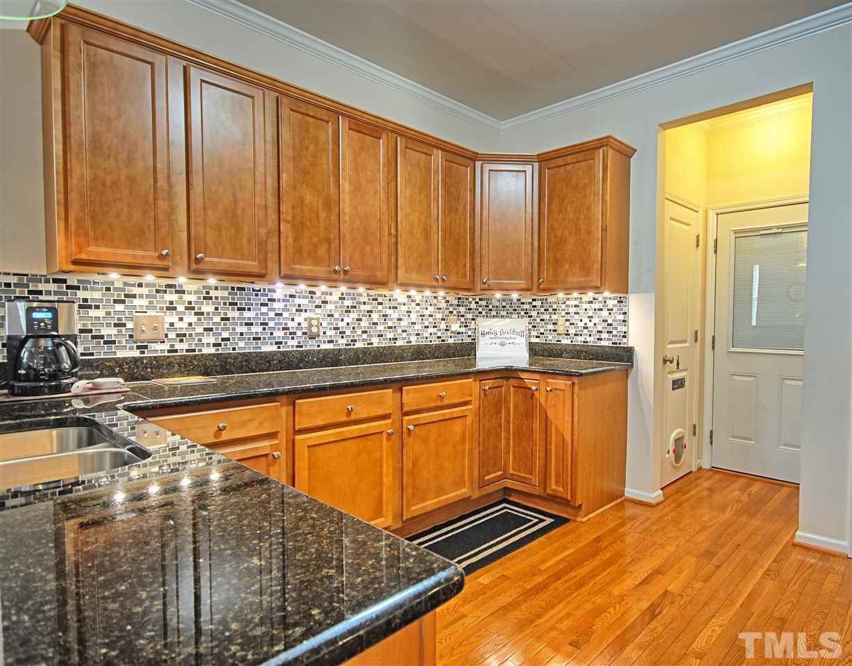4904 Jelynn Street Raleigh, NC 27616 - Photo 10 of 25 A wall of cabinets so you have plenty of storage. Under cabinet lights.