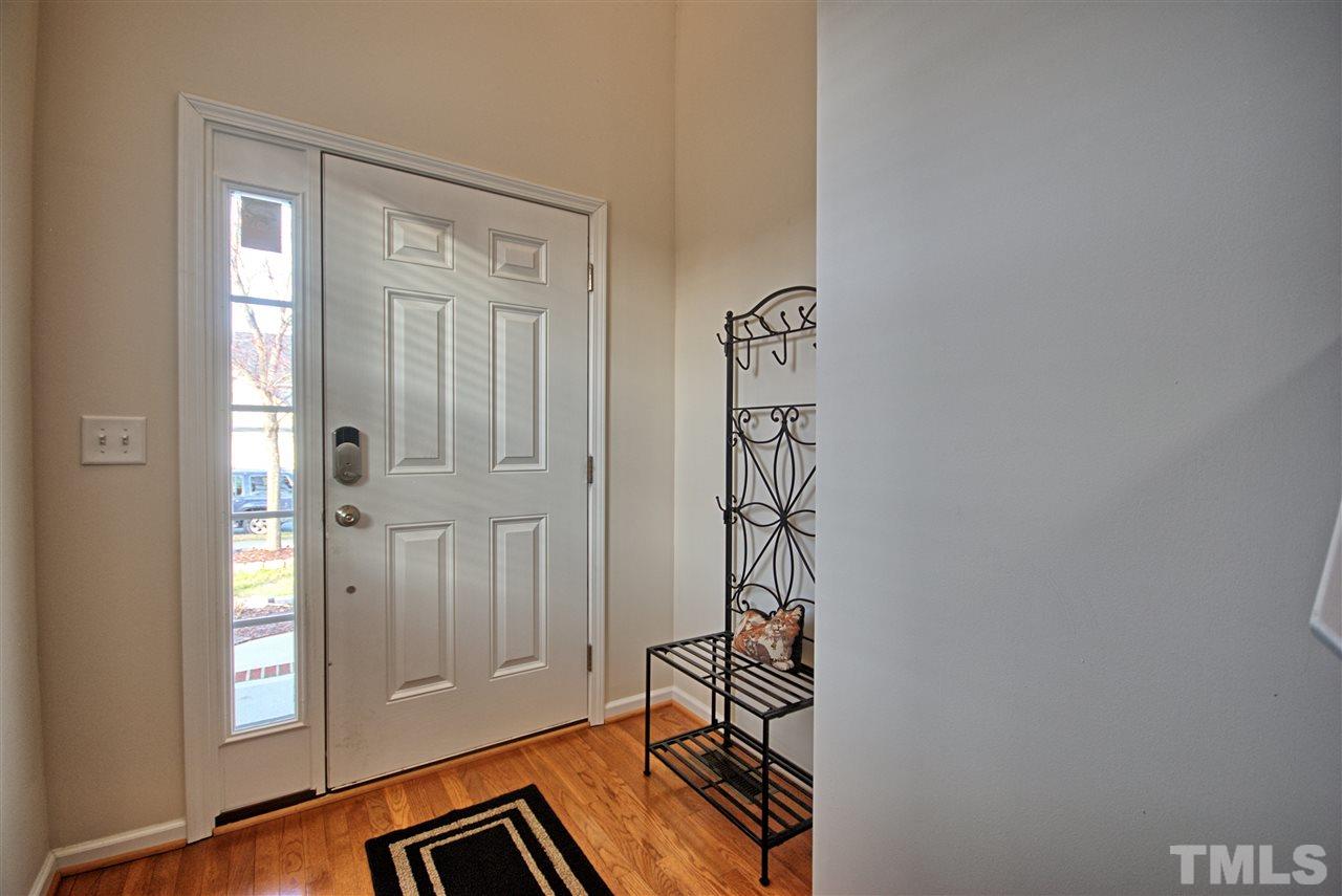 4904 Jelynn Street Raleigh, NC 27616 - Photo 3 of 25 Bright, open entry feature hardwoods and area for shoes.