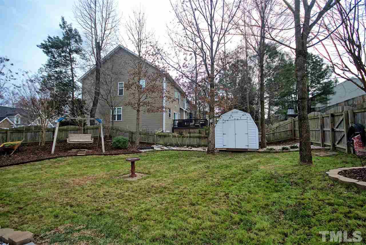 4904 Jelynn Street Raleigh, NC 27616 - Photo 20 of 25 Another view of fenced in backyard. Yes the shed stays with the home.