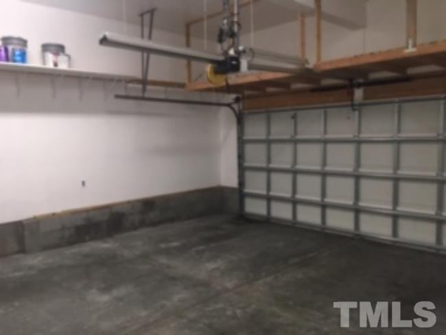 4904 Jelynn Street Raleigh, NC 27616 - Photo 24 of 25 Finished garage with overhead storage. Garage is completely insulated so no heat escapes.
