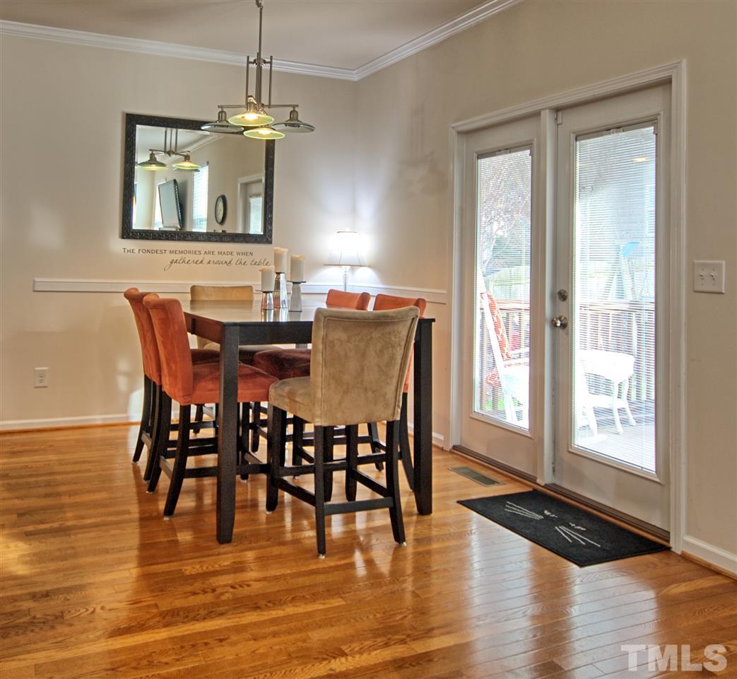 4904 Jelynn Street Raleigh, NC 27616 - Photo 7 of 25 Dining Area with Beautiful Hardwoods-Overlooks screen Porch and Back Yard. Blinds are built in to the French Doors.