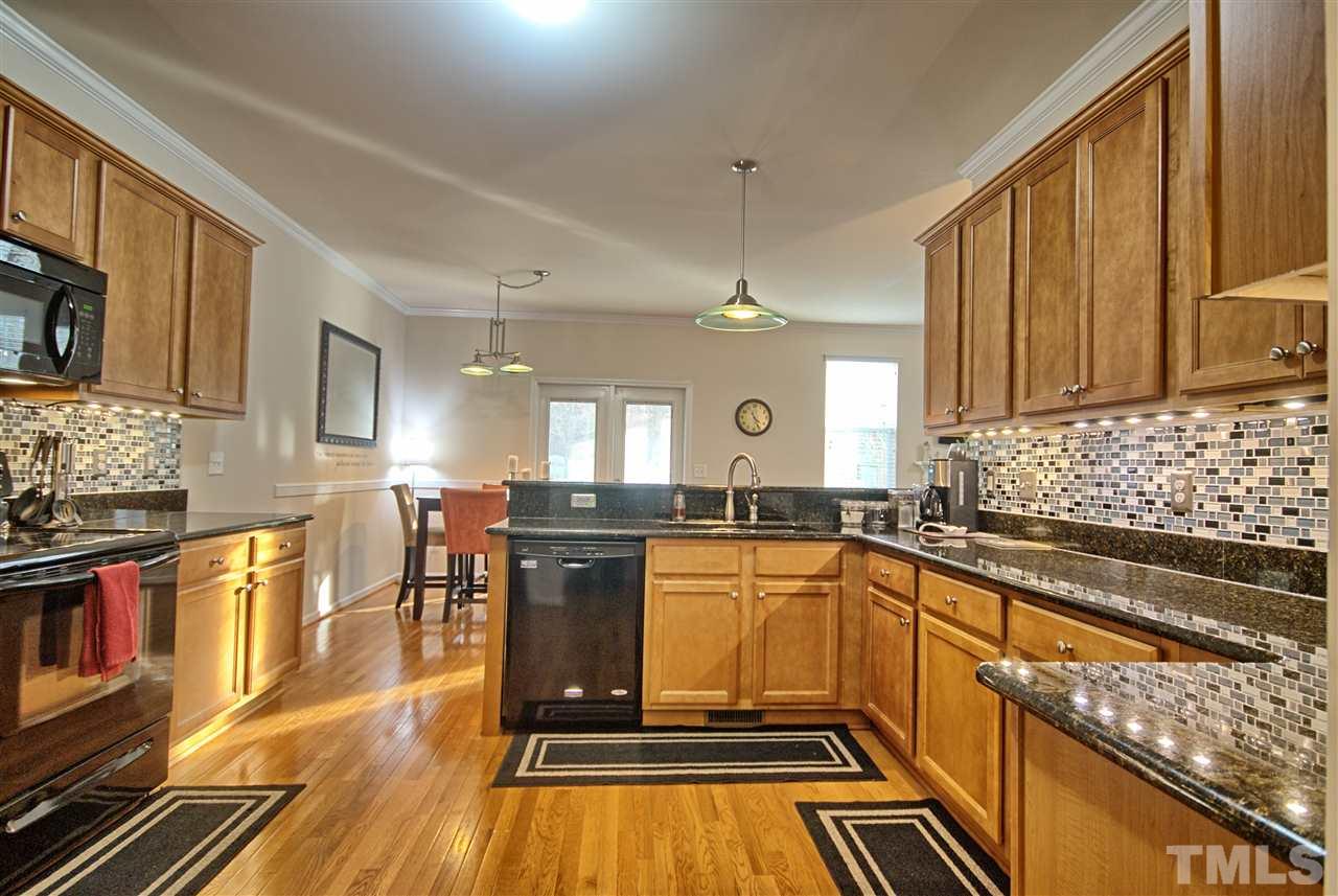 4904 Jelynn Street Raleigh, NC 27616 - Photo 9 of 25 Spacious Kitchen with beautiful hardwoods is open to Dining area & Family Room.