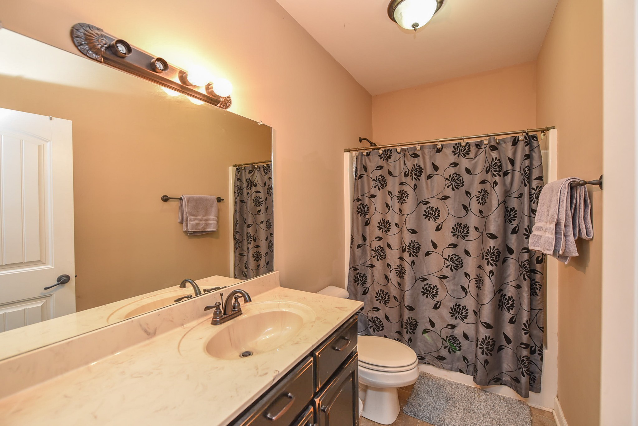 2001 West Tennessee City Road Dickson, TN 37055 - Photo 12 of 24 a bathroom with a sink toilet and shower