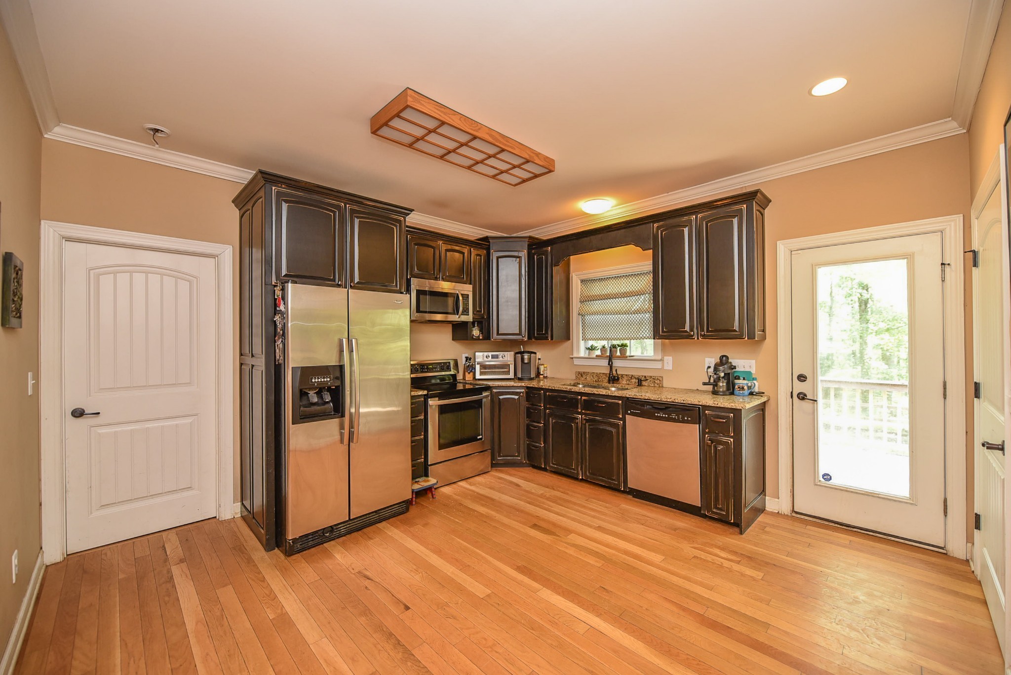 2001 West Tennessee City Road Dickson, TN 37055 - Photo 6 of 24 a kitchen with stainless steel appliances granite countertop a refrigerator and a stove top oven