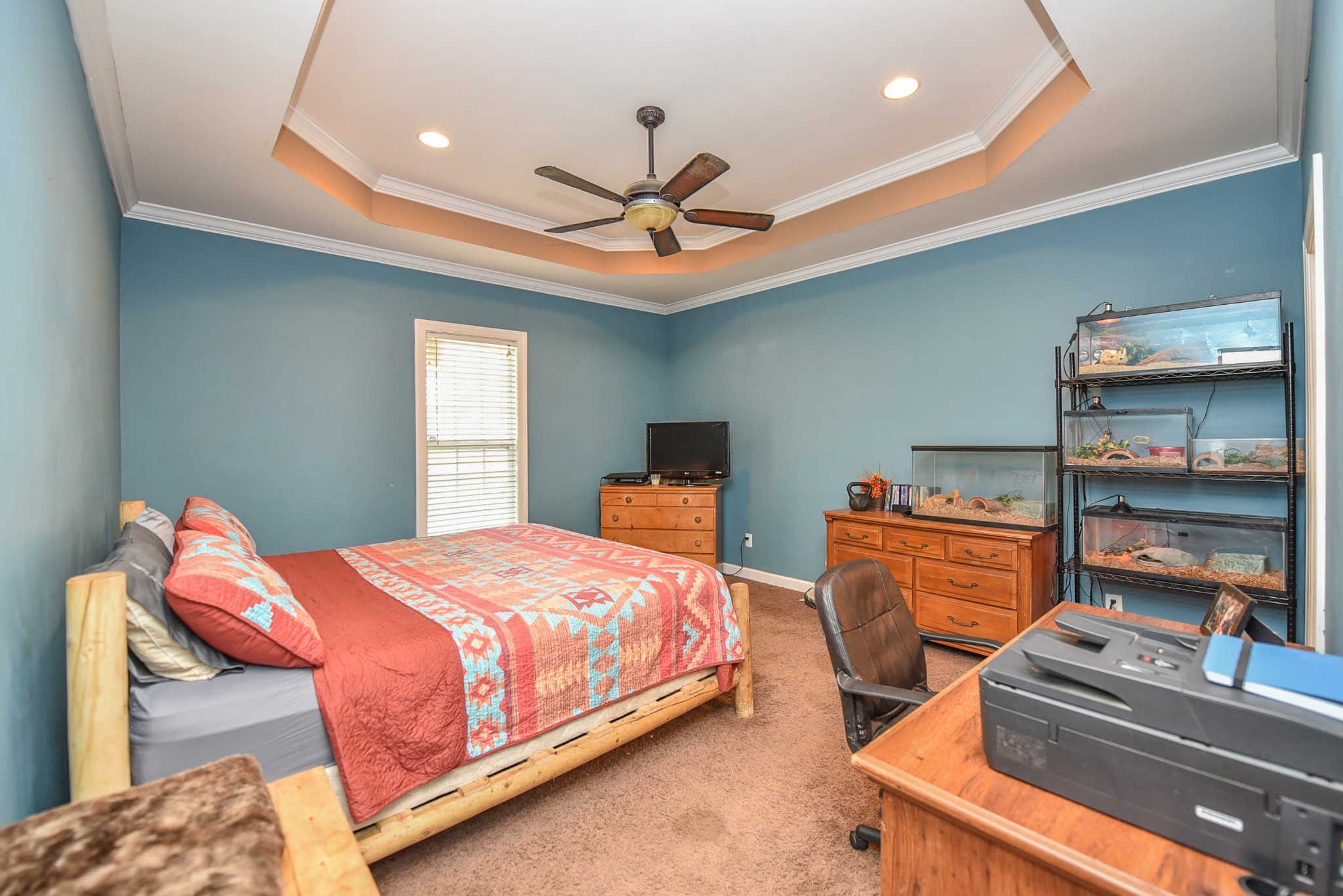 2001 West Tennessee City Road Dickson, TN 37055 - Photo 7 of 24 a bedroom with a bed and a chandelier