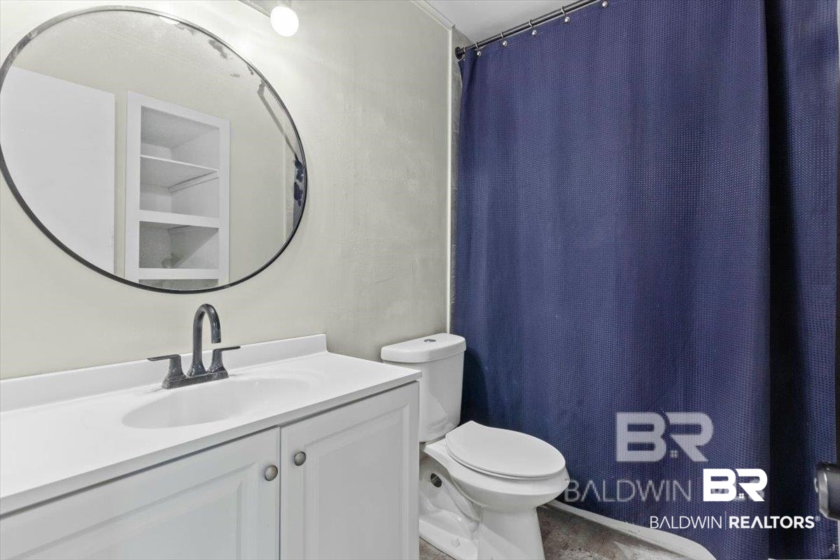 29397 Loper Road Loxley, AL 36551 - Photo 16 of 22 Full bath with curtained shower and vanity