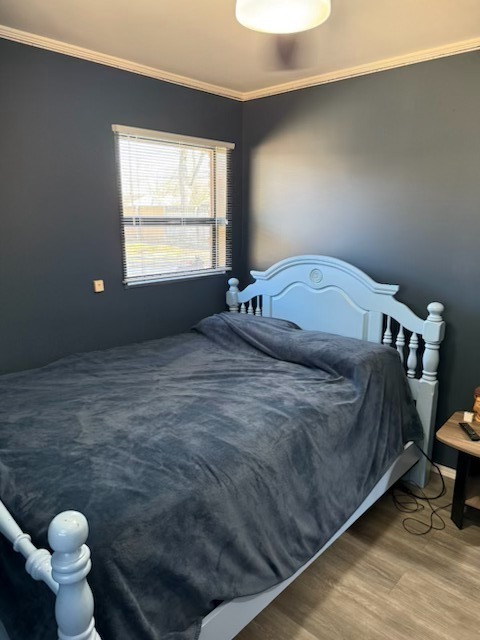 316 Mohawk Street Park Forest, IL 60466 - Photo 11 of 26 a bedroom with a bed and window