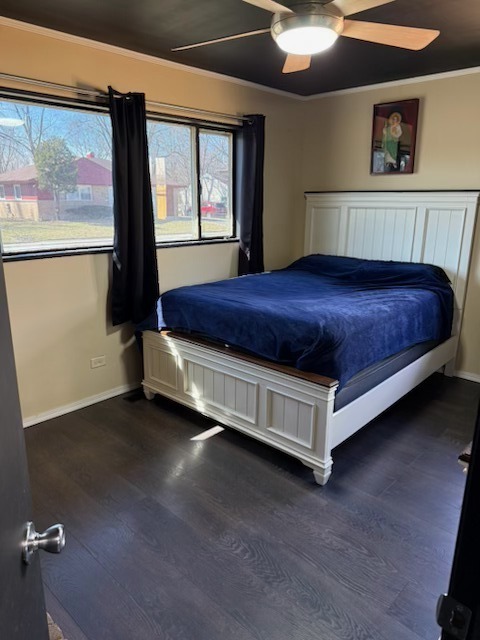 316 Mohawk Street Park Forest, IL 60466 - Photo 16 of 26 a spacious bedroom with a bed and window