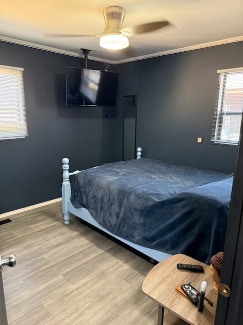 316 Mohawk Street Park Forest, IL 60466 - Photo 10 of 26 a bedroom with a bed and a chandelier