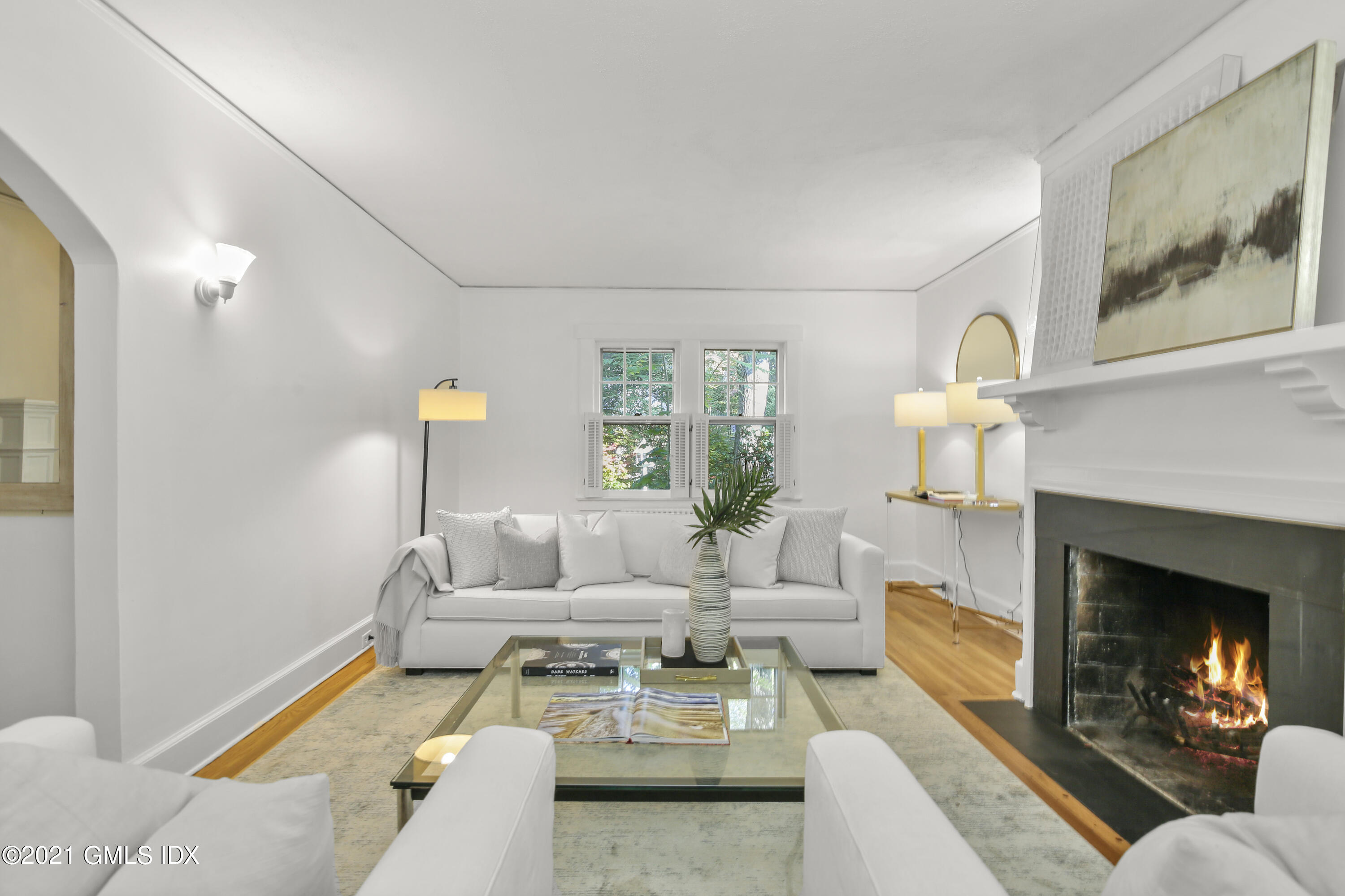 41 Butler Street Cos Cob, CT 06807 - Photo 11 of 33 a living room with furniture and a fireplace