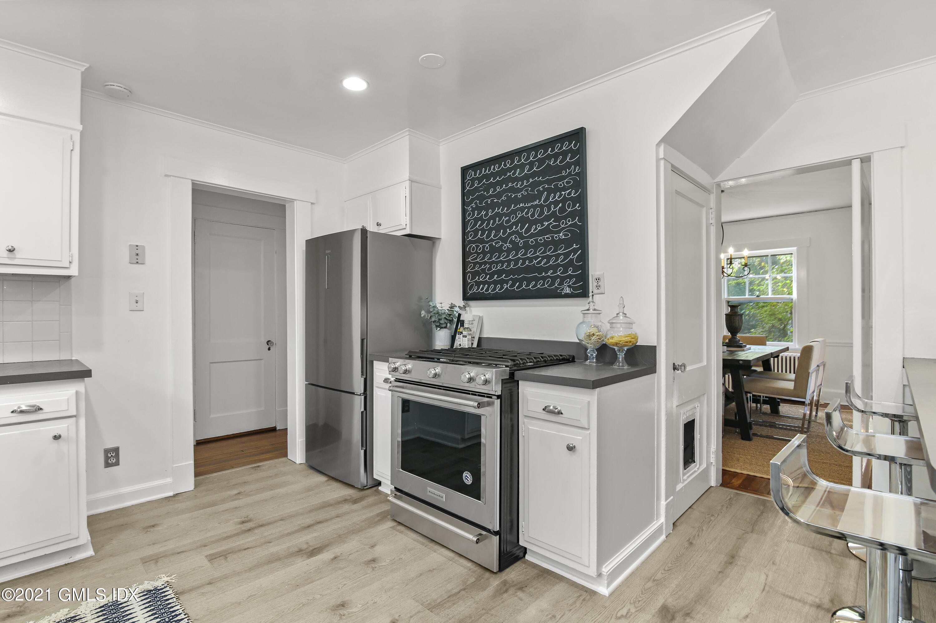 41 Butler Street Cos Cob, CT 06807 - Photo 14 of 33 a kitchen with stainless steel appliances granite countertop a stove and a refrigerator