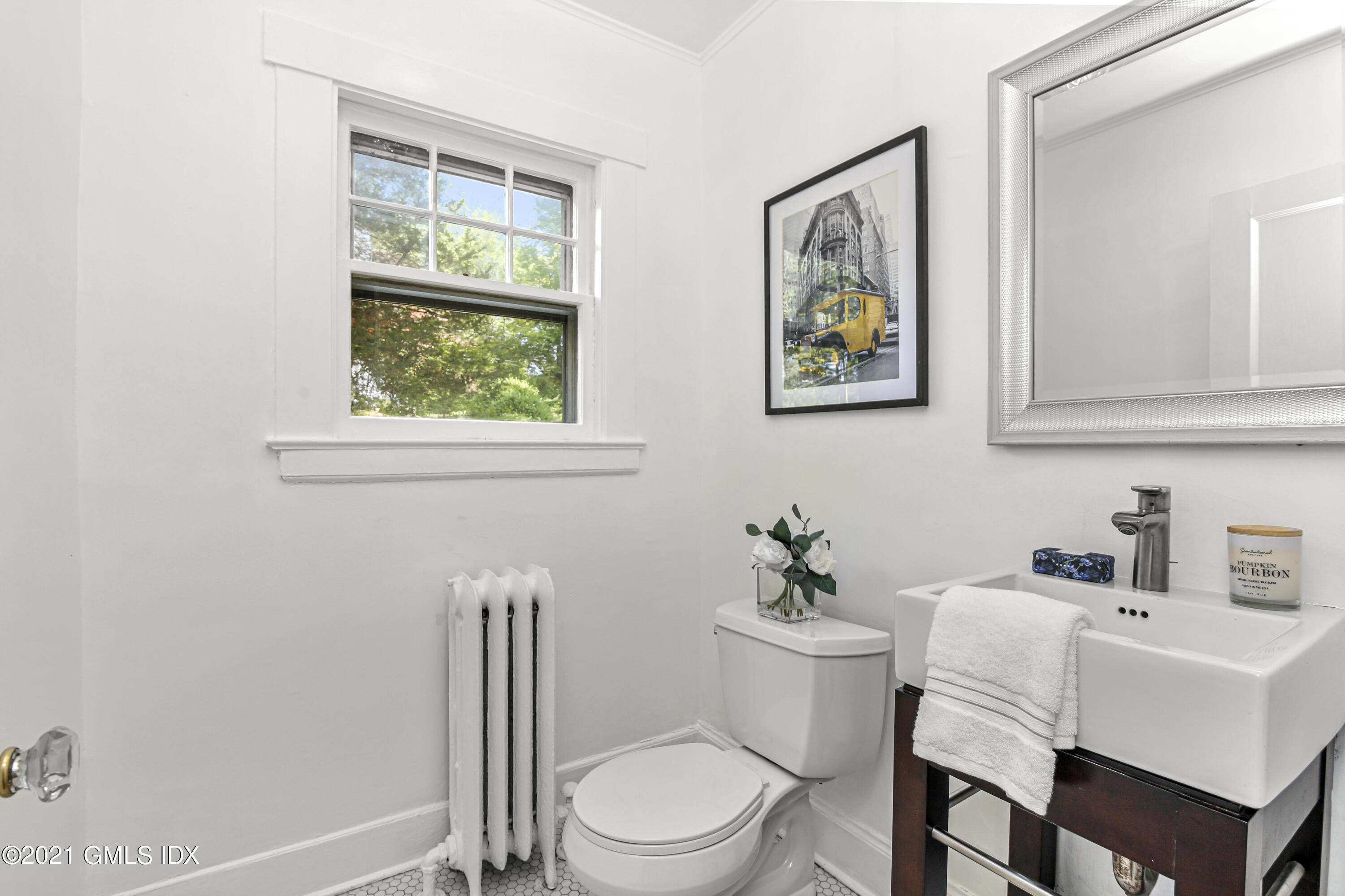 41 Butler Street Cos Cob, CT 06807 - Photo 17 of 33 a white toilet sitting next to a bathroom sink