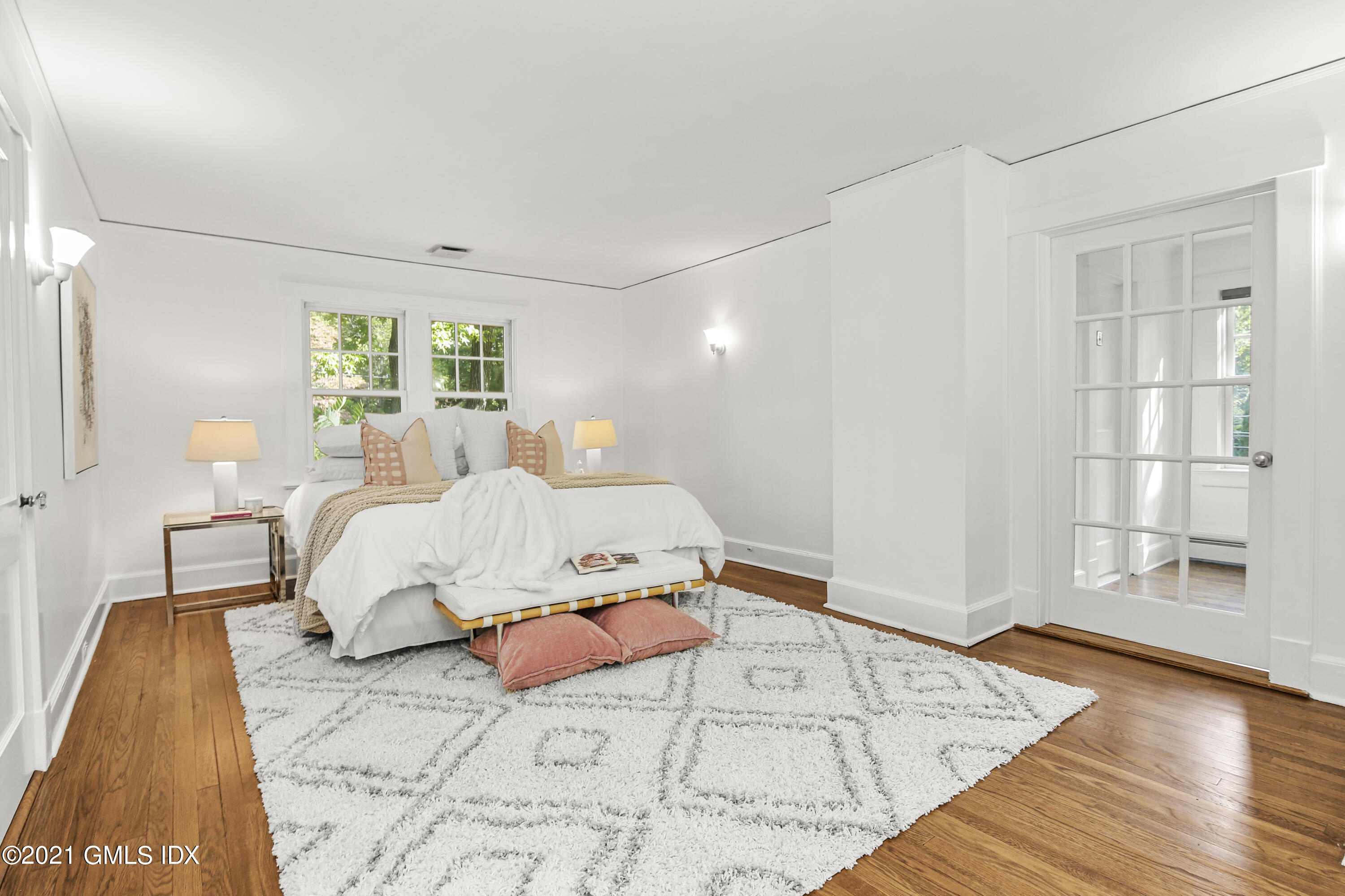 41 Butler Street Cos Cob, CT 06807 - Photo 19 of 33 a bed room with a bed and a window