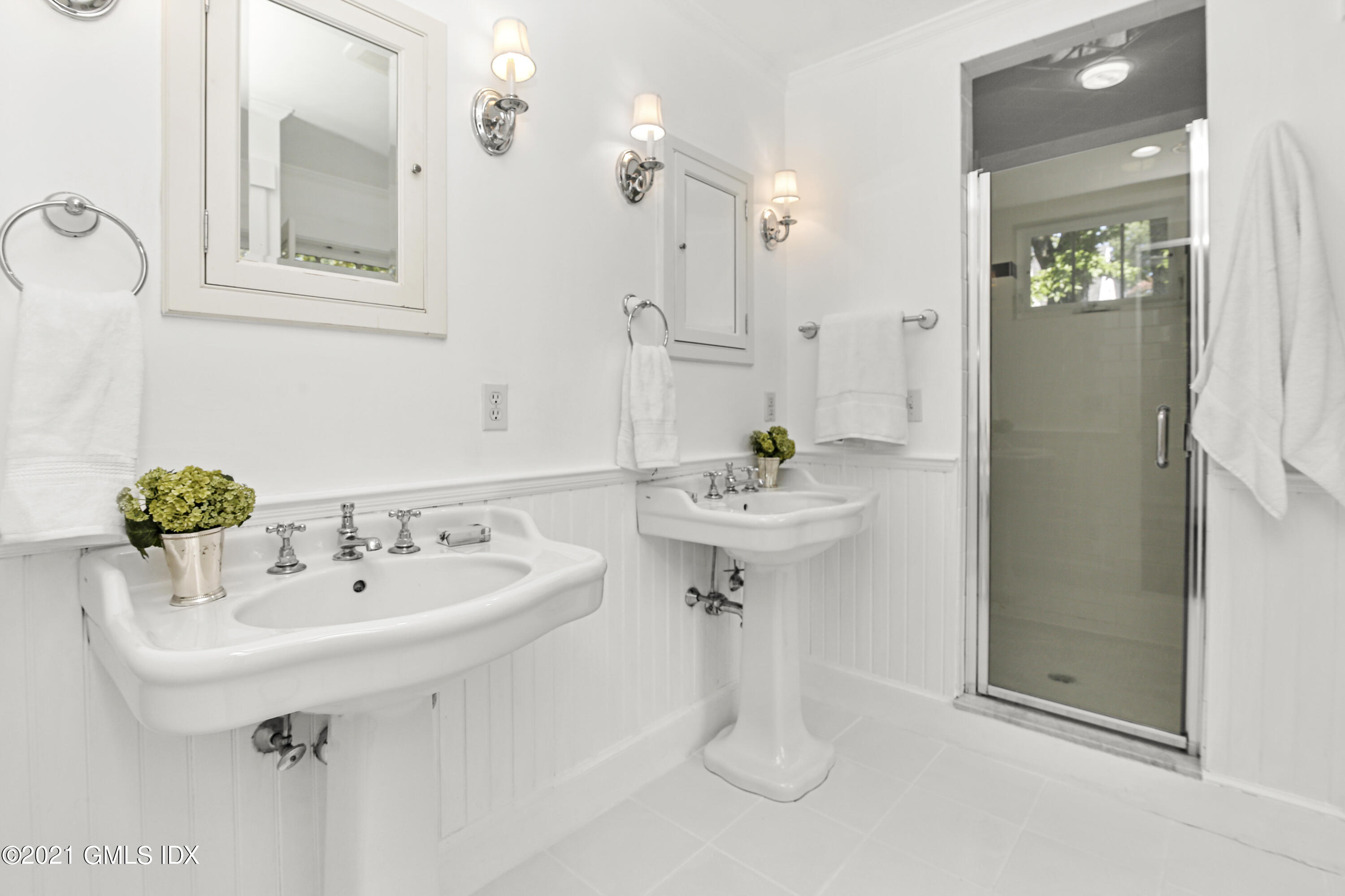 41 Butler Street Cos Cob, CT 06807 - Photo 20 of 33 a bathroom with a sink and a mirror