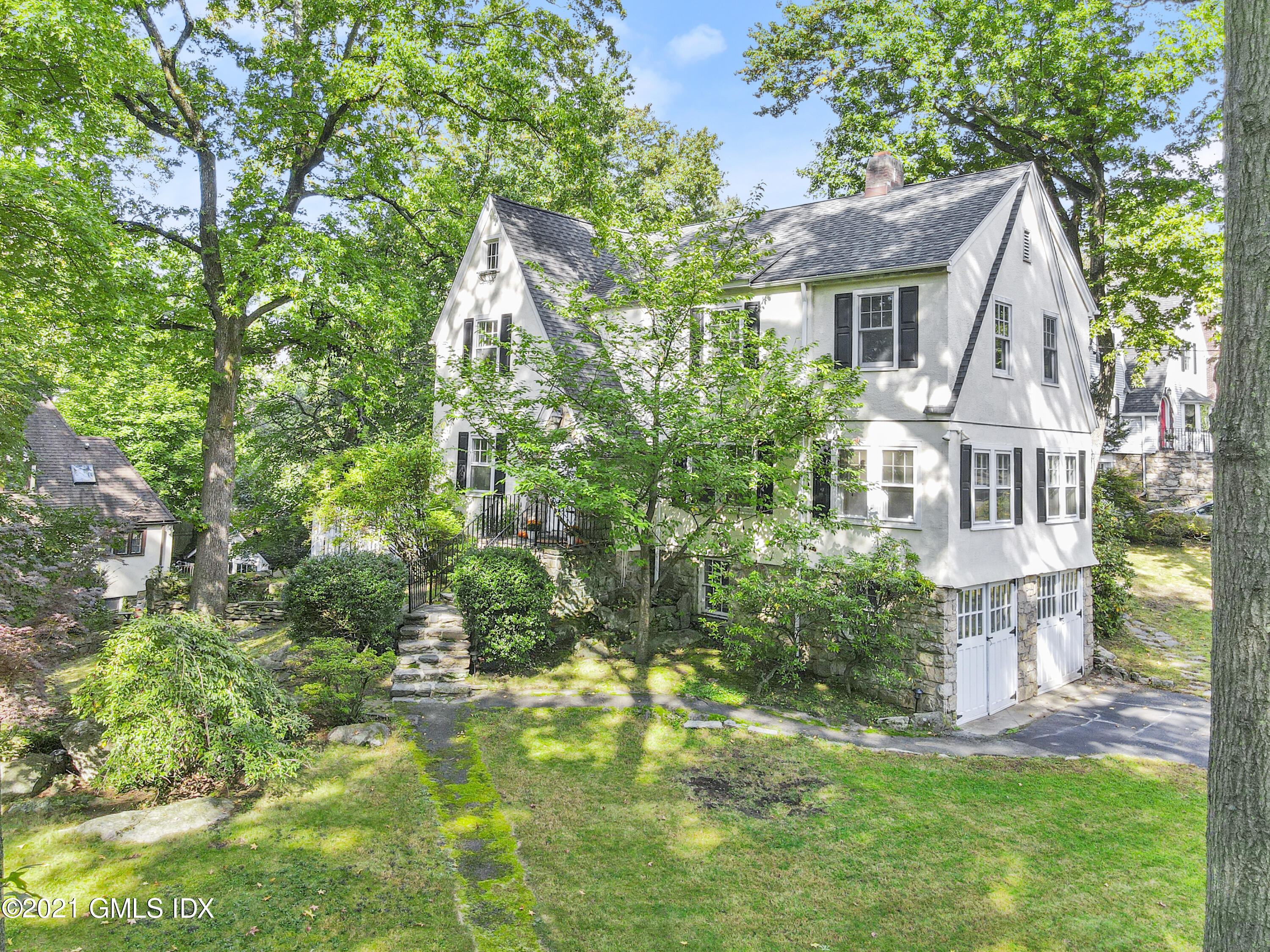 41 Butler Street Cos Cob, CT 06807 - Photo 2 of 33 a aerial view of a house with a yard and plants