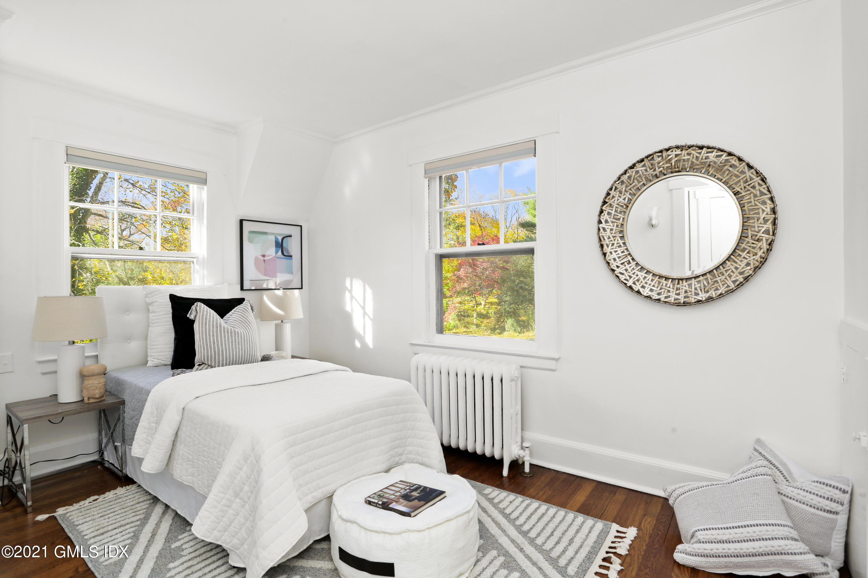 41 Butler Street Cos Cob, CT 06807 - Photo 22 of 33 a bedroom with a bed and a window