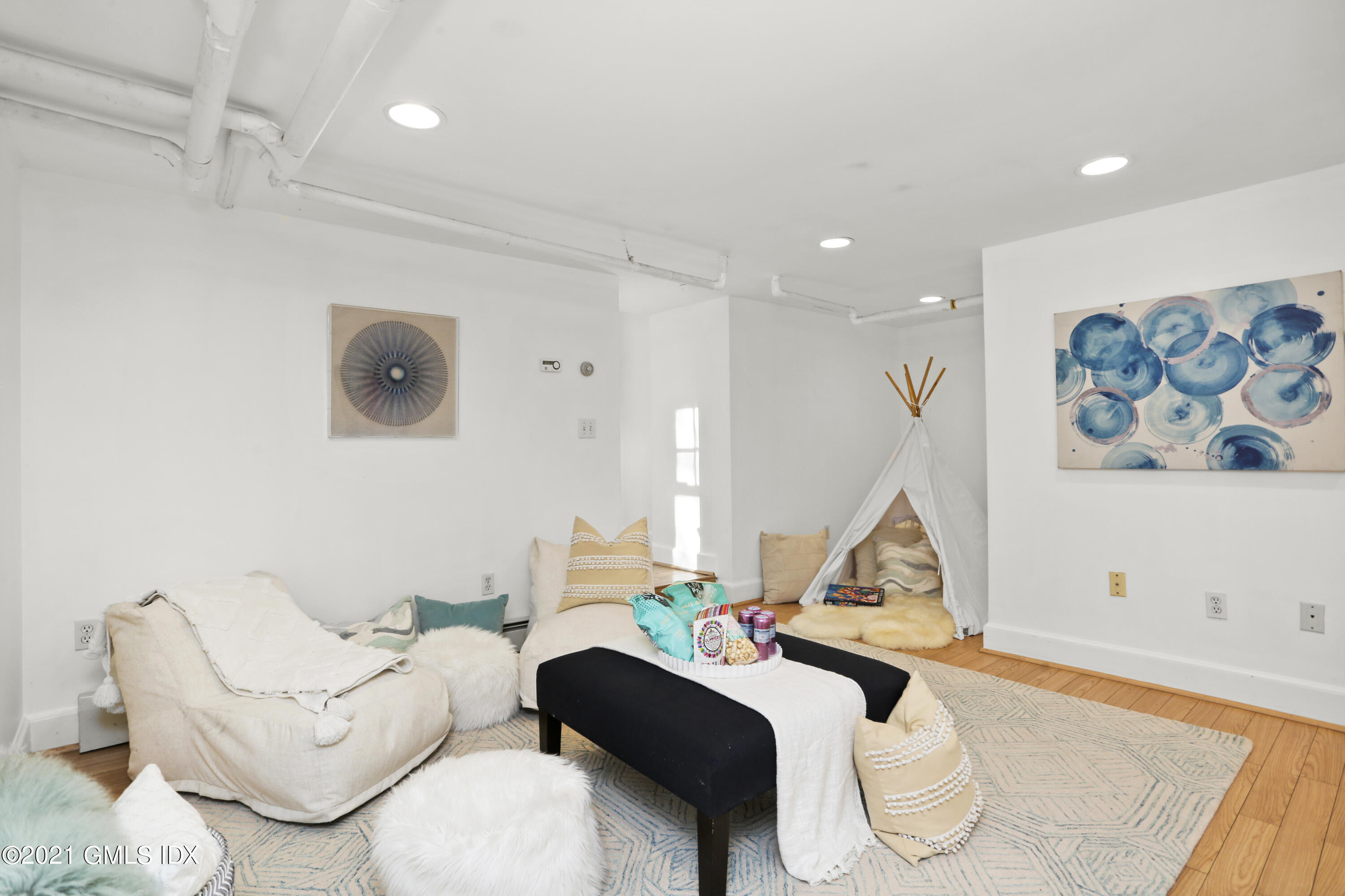 41 Butler Street Cos Cob, CT 06807 - Photo 24 of 33 a living room with furniture and a flat screen tv