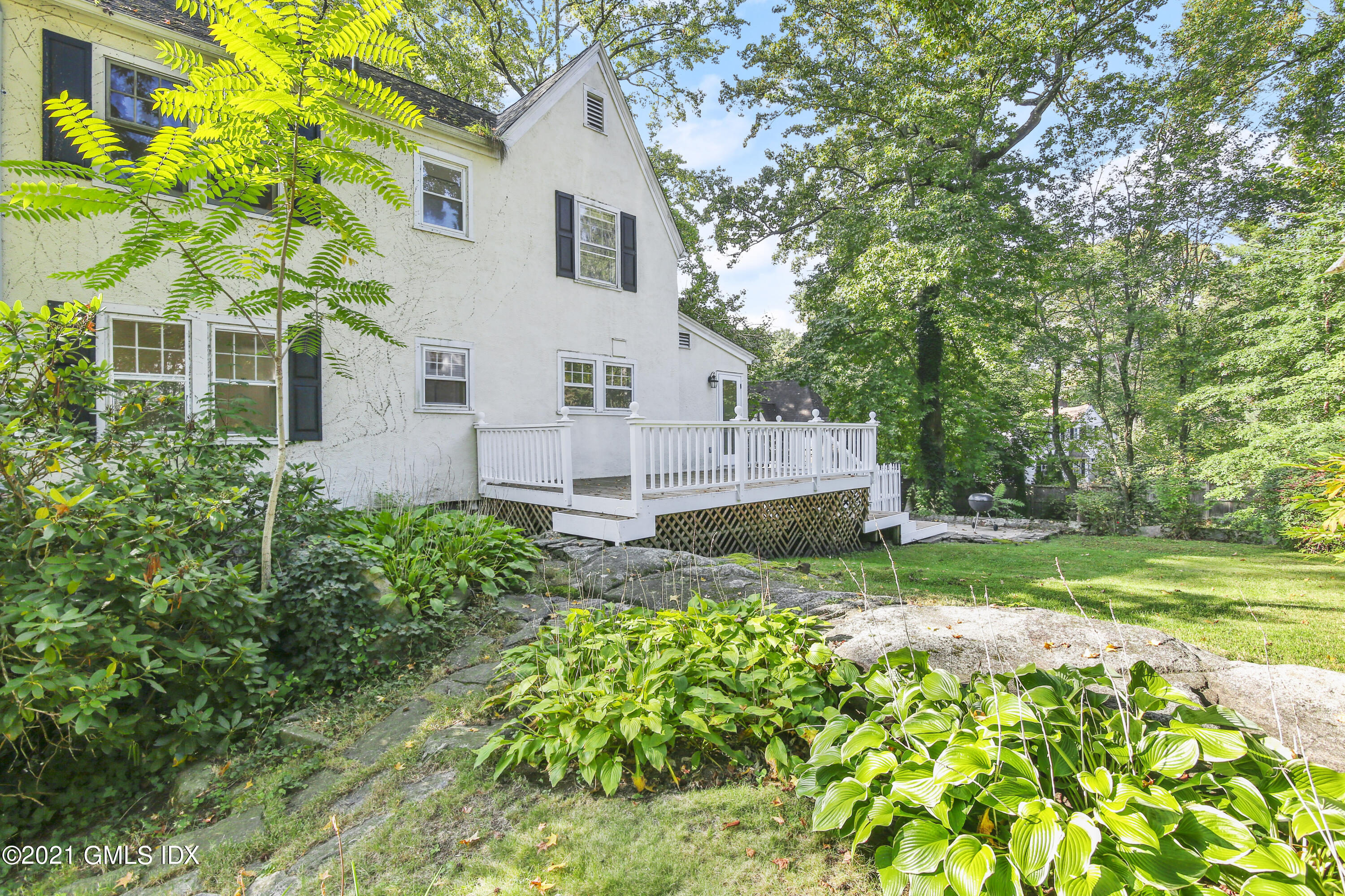 41 Butler Street Cos Cob, CT 06807 - Photo 26 of 33 a view of a house with a yard and sitting area