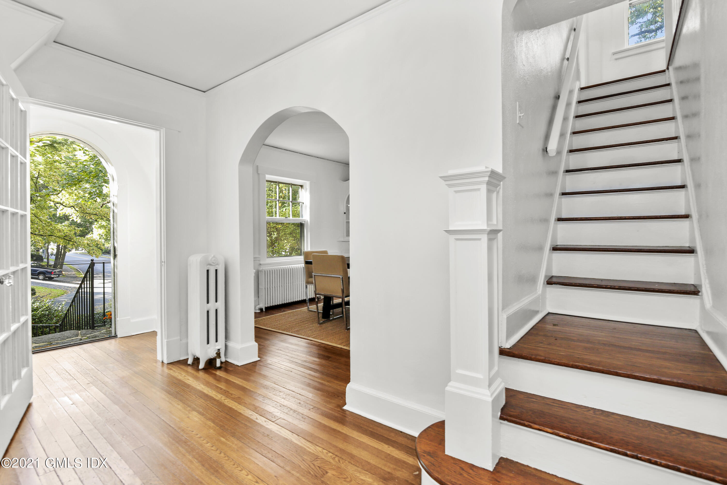 41 Butler Street Cos Cob, CT 06807 - Photo 6 of 33 a view of a livingroom with wooden floor and stairs