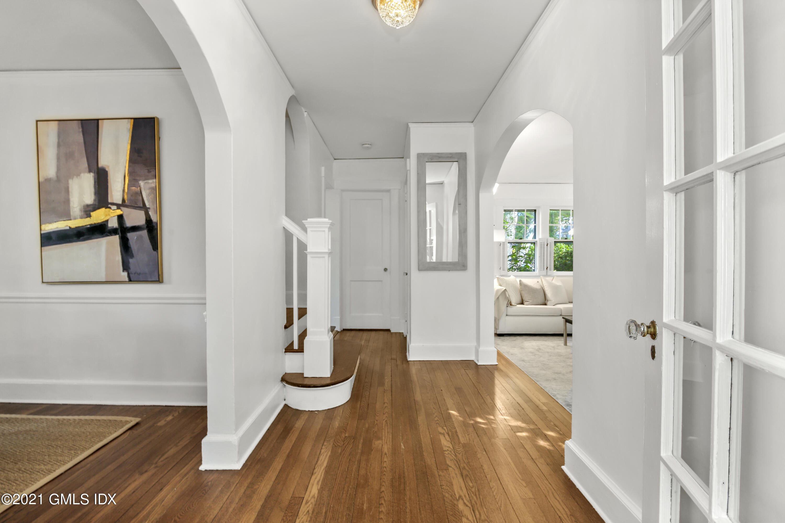 41 Butler Street Cos Cob, CT 06807 - Photo 7 of 33 a view of a bedroom with wooden floor and windows