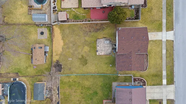 an aerial view of residential house with outdoor space