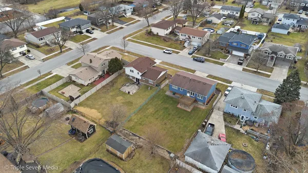an aerial view of residential houses with outdoor space