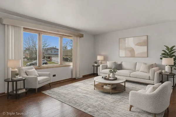 a living room with furniture and a large window