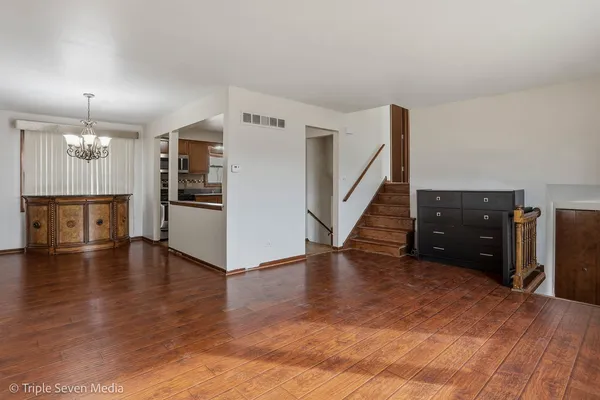 a view of a kitchen with a sink and a refrigerator