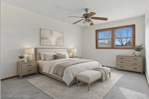 a bedroom with a bed and a dresser