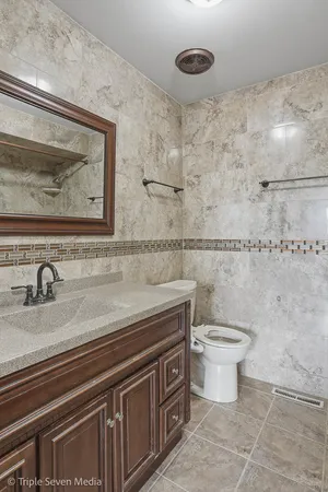 a bathroom with a toilet and a sink