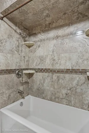 a bathroom with a bathtub