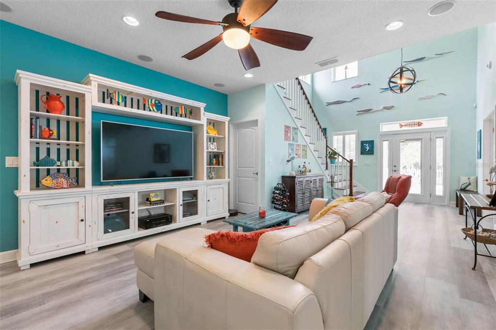 47 Sandy Beach Way Palm Coast, FL 32137 - Photo 14 of 70 a living room with furniture and a flat screen tv