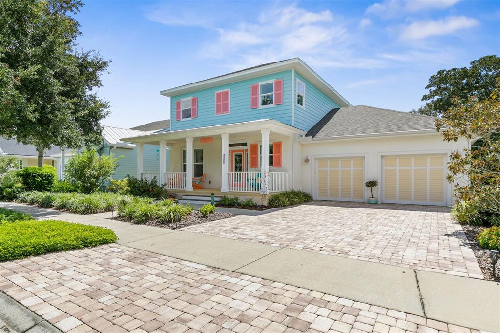 47 Sandy Beach Way Palm Coast, FL 32137 - Photo 5 of 70 a front view of a house with a yard and a garage