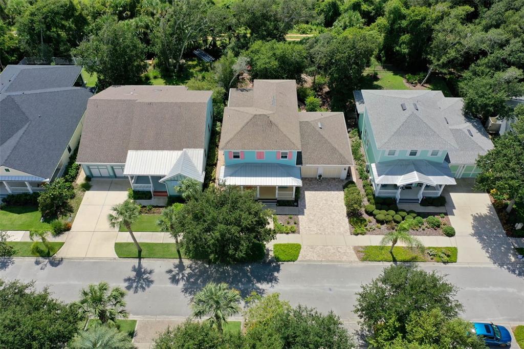 47 Sandy Beach Way Palm Coast, FL 32137 - Photo 57 of 70 an aerial view of a house with a garden and swimming pool