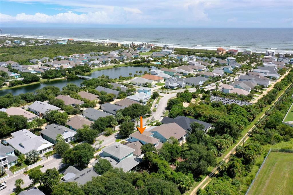 47 Sandy Beach Way Palm Coast, FL 32137 - Photo 60 of 70 an aerial view of residential houses with outdoor space and ocean view