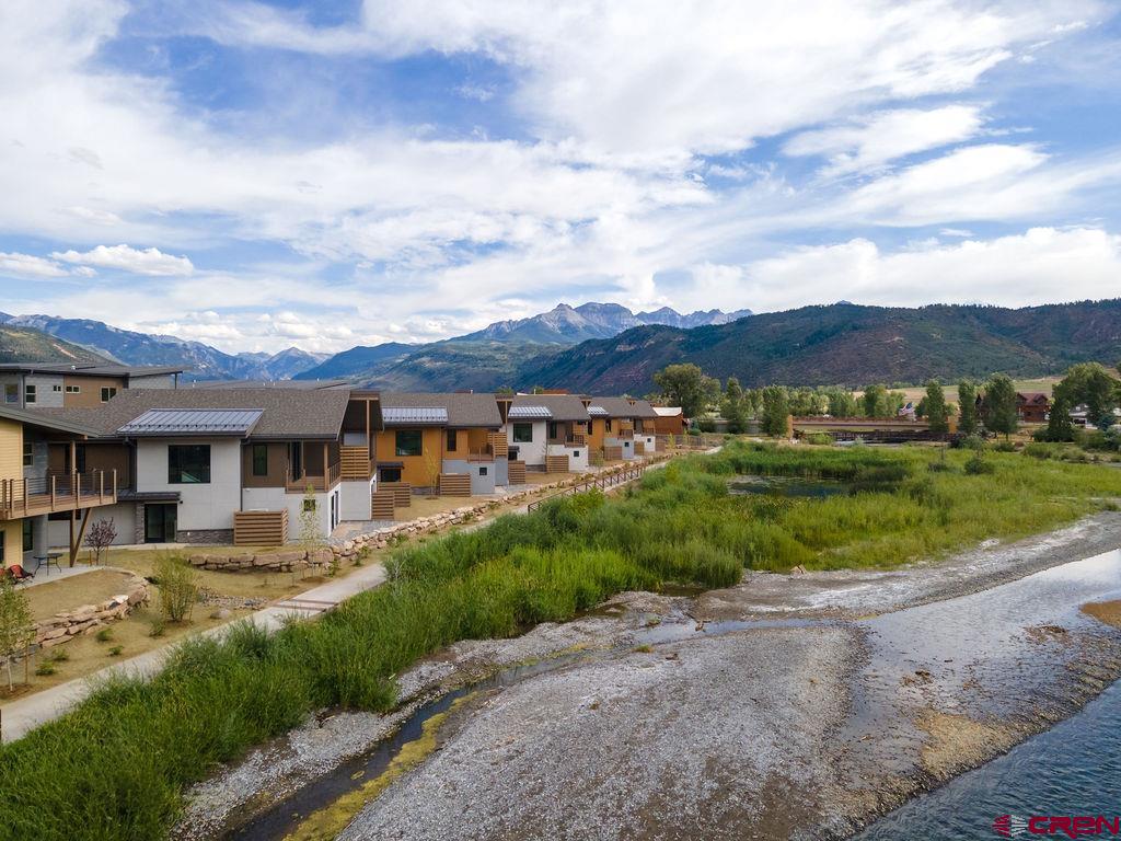 154 Alpine Lane, Unit 200 Ridgway, CO 81432 - Photo 14 of 29 an aerial view of residential houses with outdoor space and trees