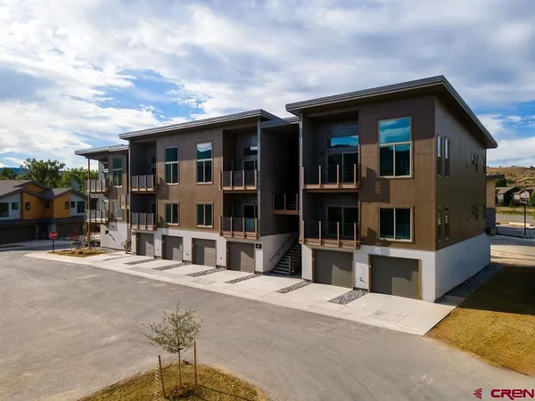 a view of house with outdoor seating