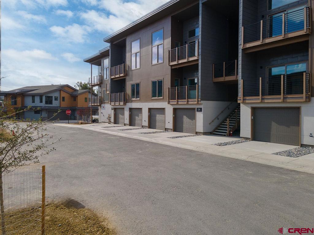 154 Alpine Lane, Unit 200 Ridgway, CO 81432 - Photo 26 of 29 a front view of building with large windows