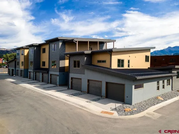 a front view of a house with a garage
