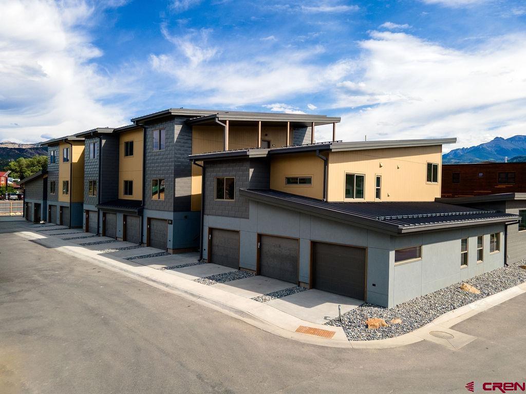 154 Alpine Lane, Unit 200 Ridgway, CO 81432 - Photo 3 of 29 a front view of a house with a garage